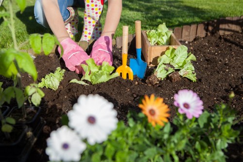 Experienced landscapers working on a project in Enfield